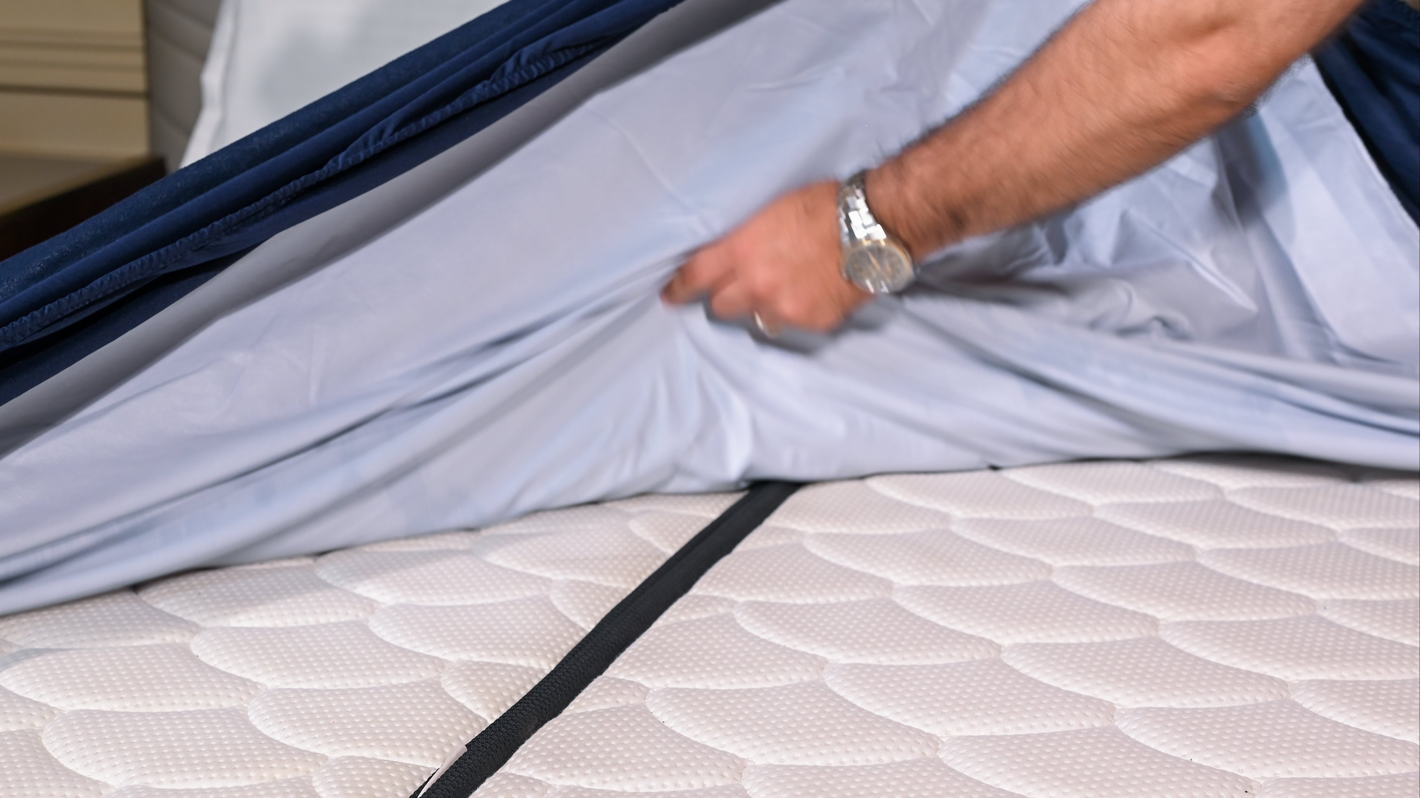 Take the mattress protector out from its packaging and unfold it fully. It might look like a regular sheet, but it does a lot more!